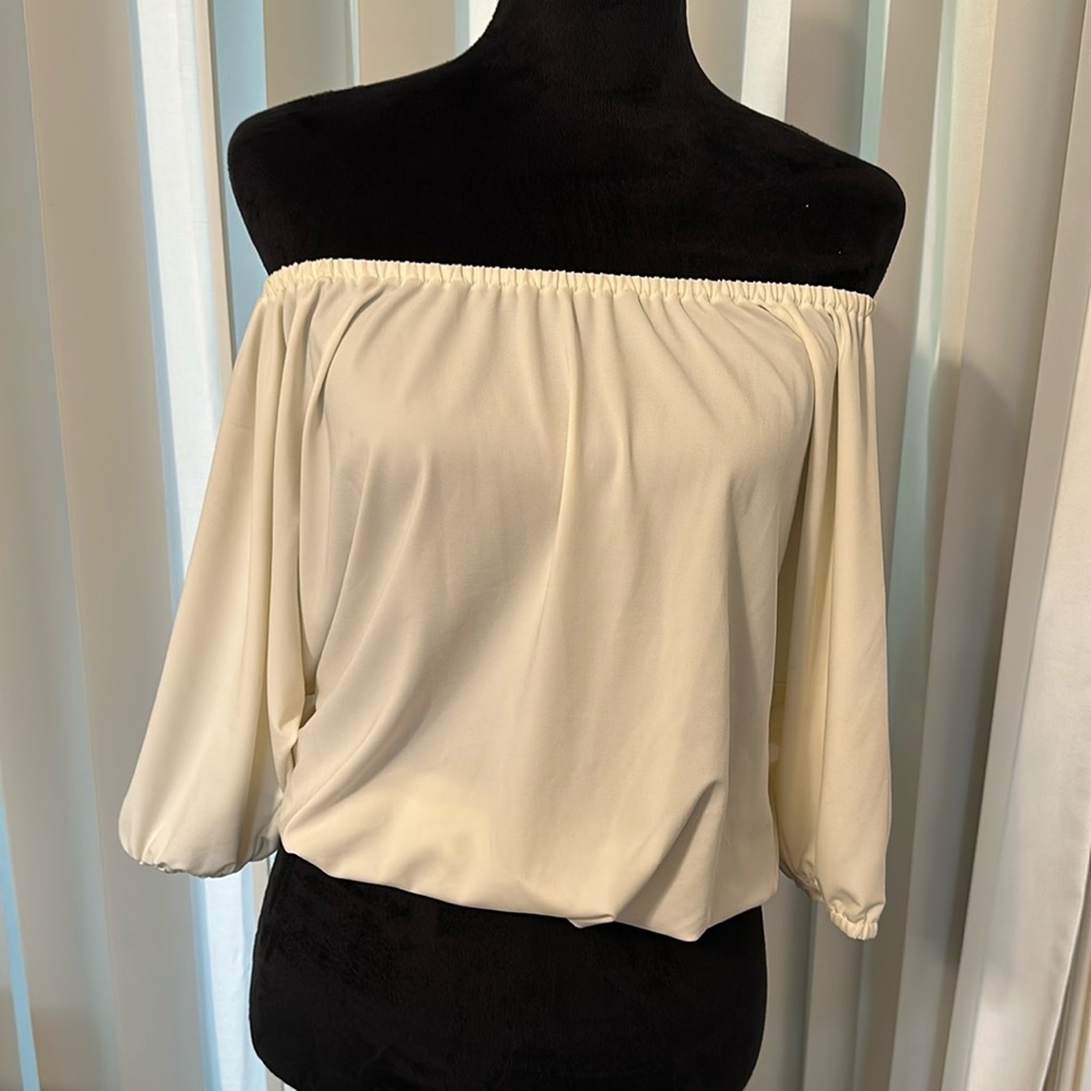 Cream off shite top that can be worn in many ways classy
